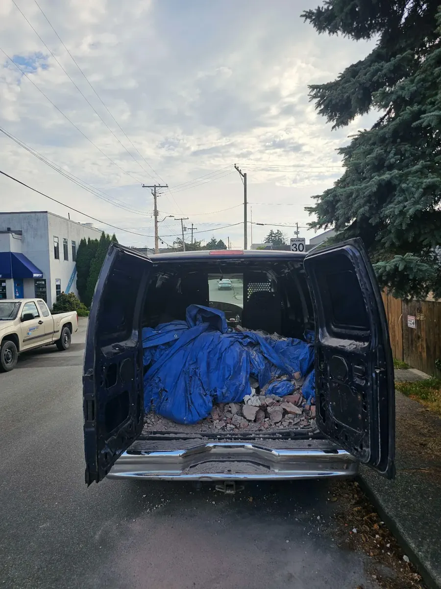 NoMo Junk van loaded with demolition debris for removal in Greater Victoria