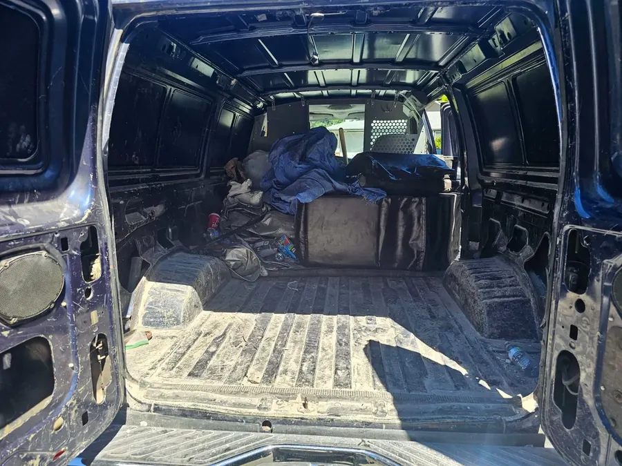 Interior of NoMo Junk van during a furniture and junk removal job